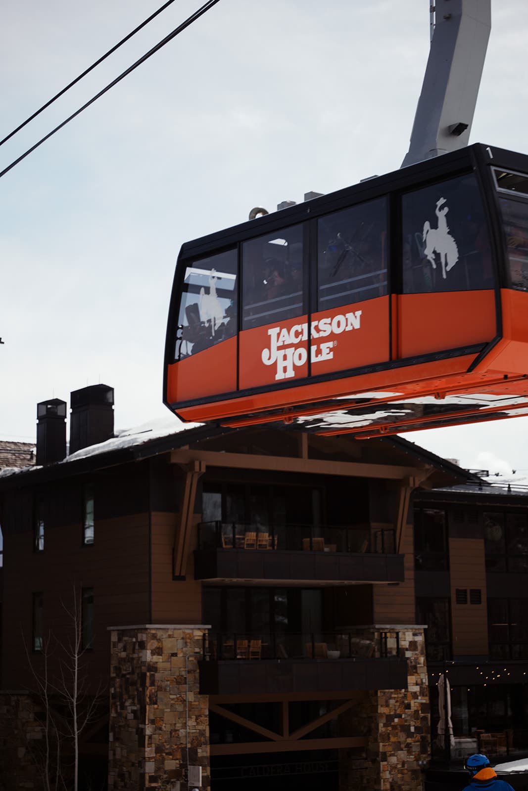 A photo of an aerial tram departing a station