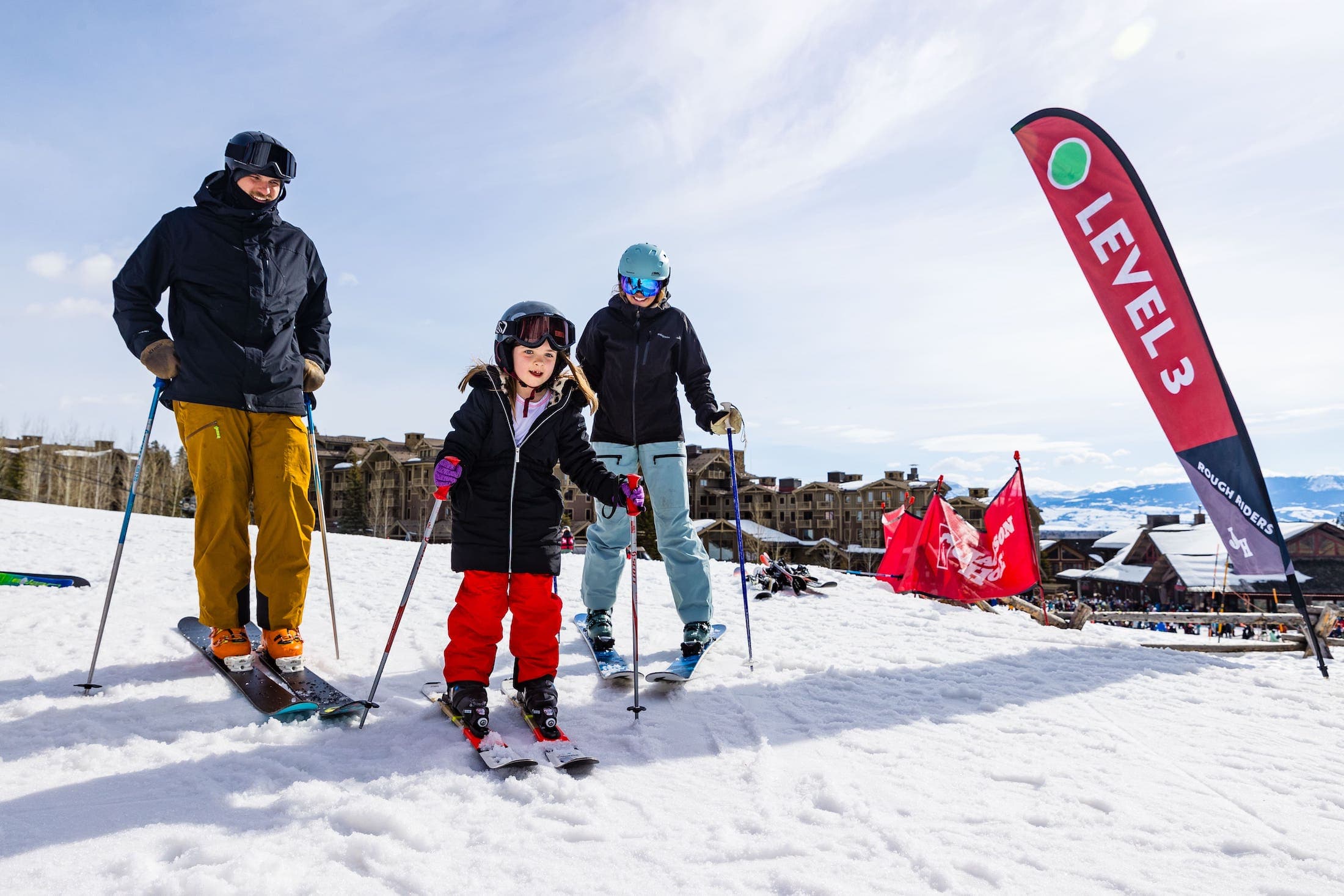A family skiing at Teton Mountain Lodge