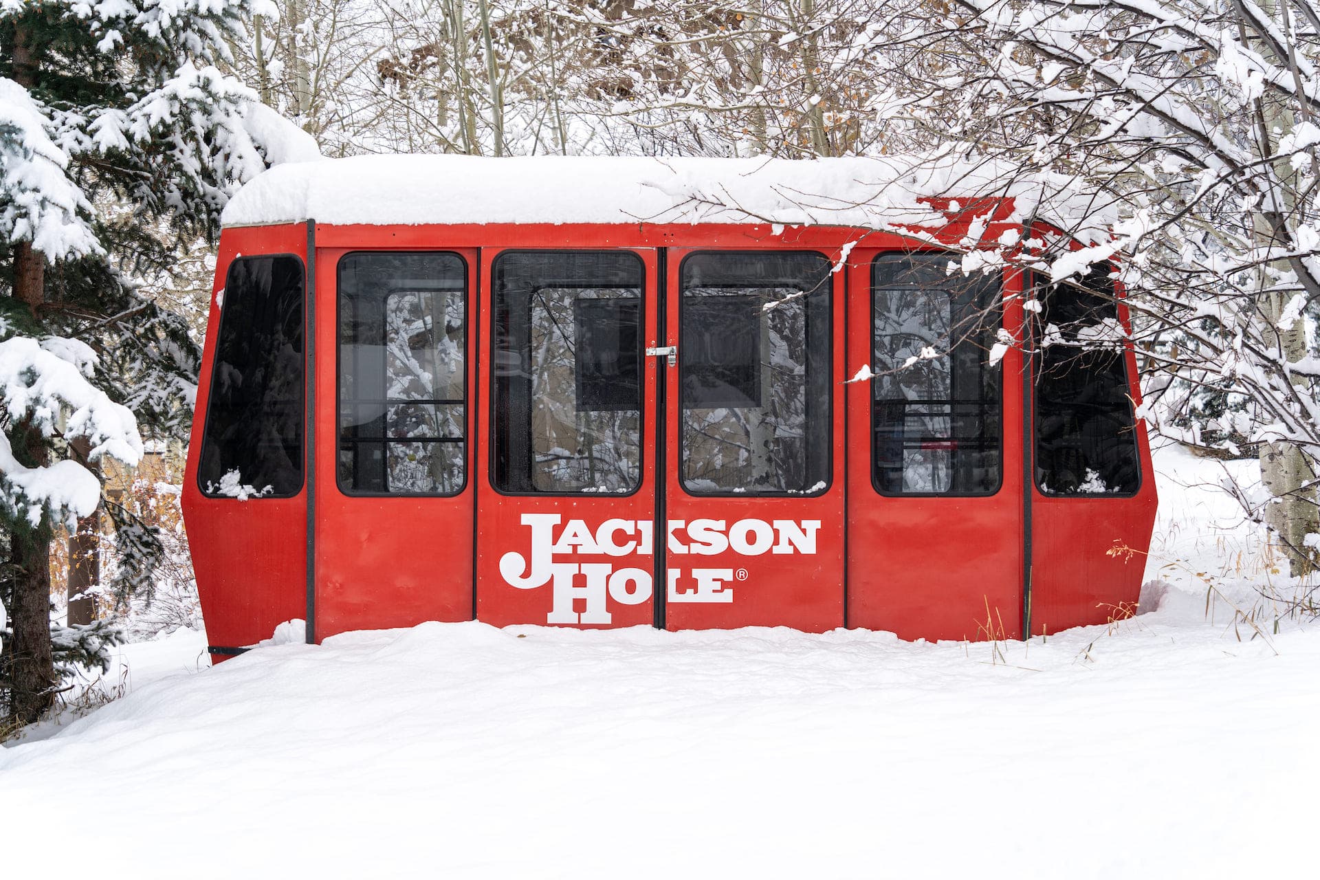 A photo of an aerial tram amidst light snowfall