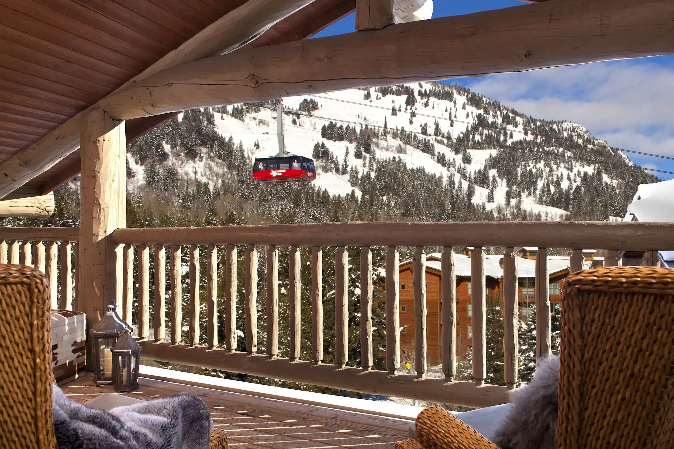 Teton Mountain Lodge & Spa Suite Balcony with Tram going past and the mountains in the background