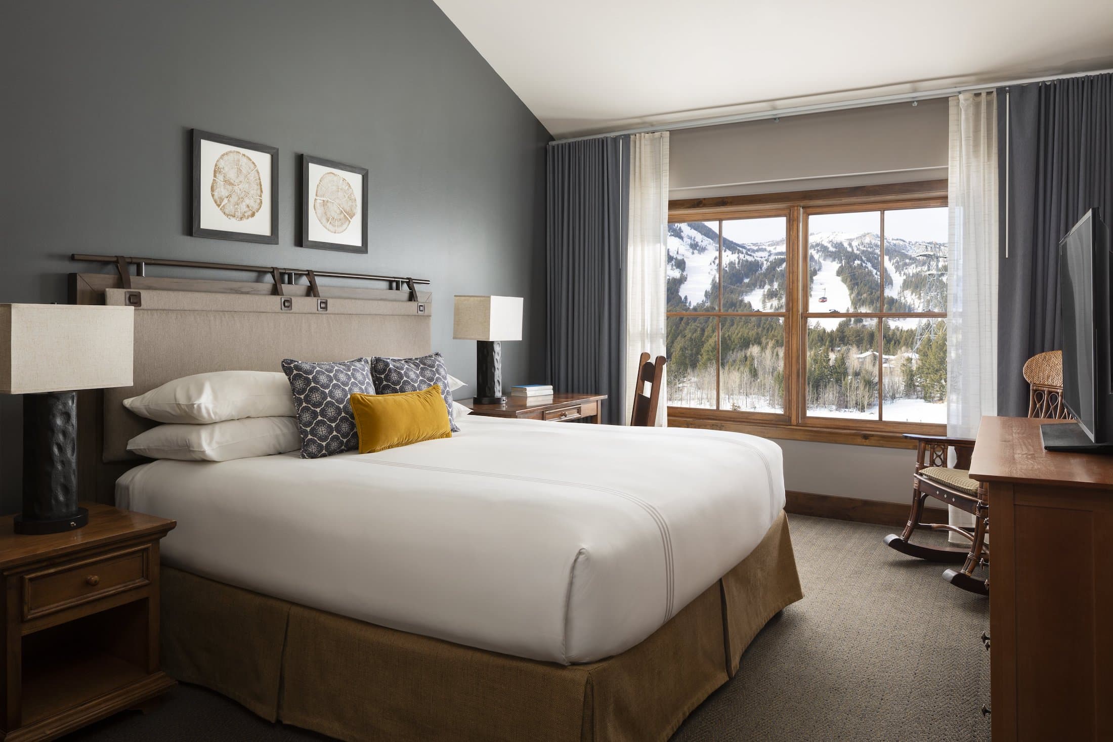 The master bedroom of a Bi-level suite with a Queen-sized bed at the Teton Mountain Lodge