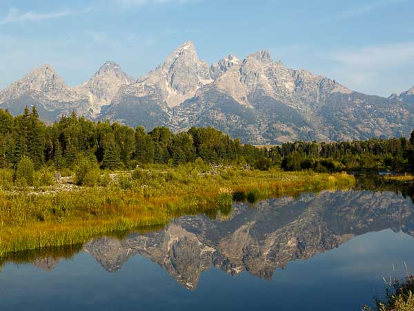 A lake and the tetons in the fall.