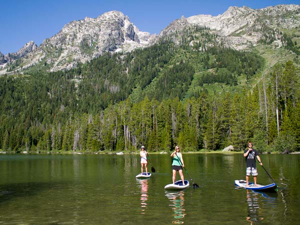 Stand up paddleboarding near the Tetons.
