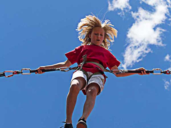 Girl On A Bungee Trampoline.