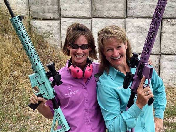 Girls Shooting Guns.