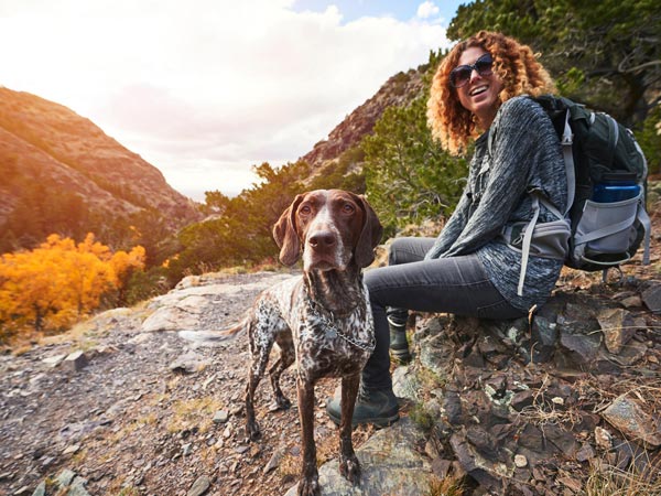 woman and her dog hiking